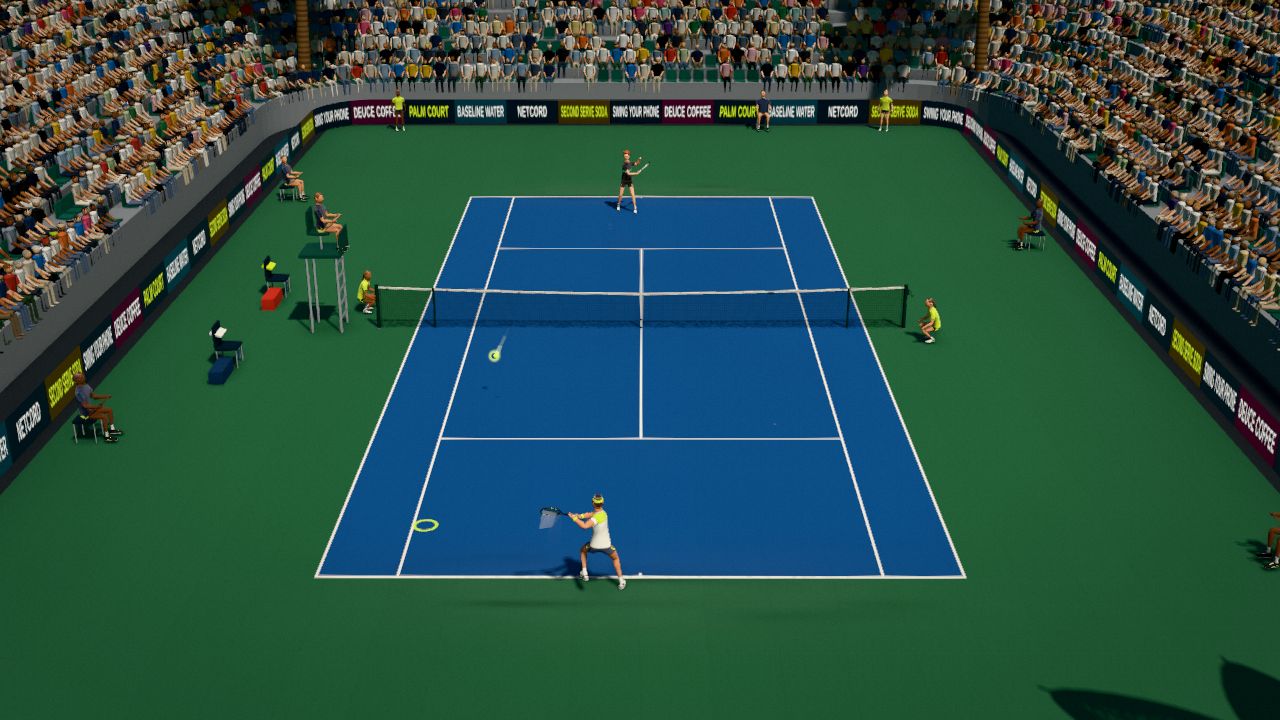 The TV camera view of a rally on a blue hard court